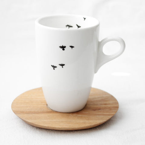 White coffee mug with bird print and wooden Saucer 