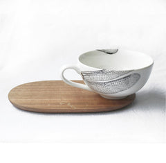 White tea cup with dragonfly print and wooden saucer 