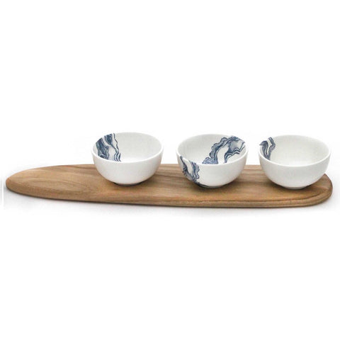 Three white snack bowls with blue mineral print and wooden tray