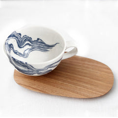 White tea cup with indigo mineral print and wooden Saucer 