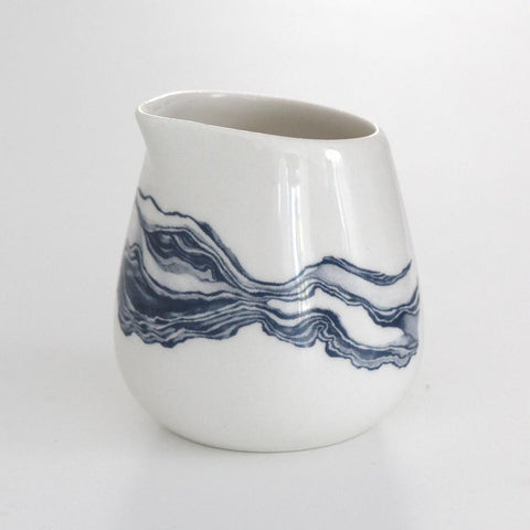 White milk jug with blue mineral print
