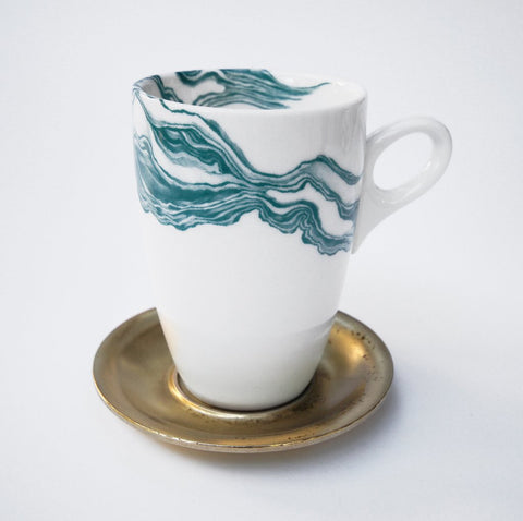 White coffee mug with teal mineral print and brass metal saucer 