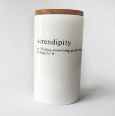 white tall jar with serendipity message