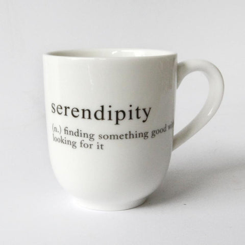 white mug with serendipity message